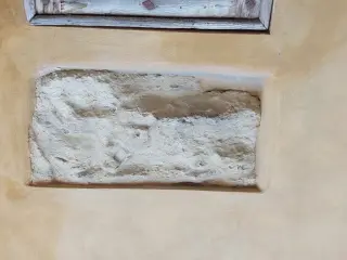 Bassorilievo murato sul fianco, forse San Martino - Oratorio di San Bartolomeo a Valenza